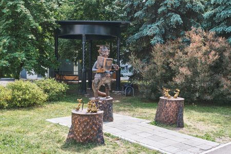 Kazan, Russia - June 15, 2023: Monument to Scientist Cat. Small architectural form in form of figure of cat in a confederate, and Mice shooting from slingshot, in Yard Park of University.のeditorial素材