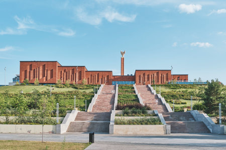 Kazan, Russia June 16, 2023: National Library of Republic of Tatarstan. Main book depository of Tatarstan. Facade of modern building on hill and stairs leading to it. Summer city landscape.のeditorial素材