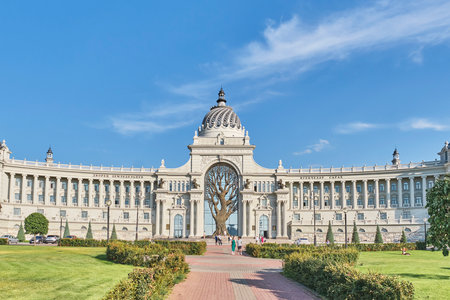 Kazan, Russia - June 16, 2023: People walking near Palace of Farmers. Modern landmark of city. Building's eclectic, monumental exterior. Summer cityscapeのeditorial素材