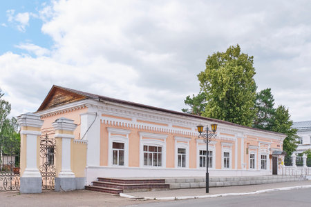 Yelabuga, Russia - June 18, 2023: Building of trade wing in historical downtown. Part of estate of merchant Stakheev. 19th century. Cultural heritage site. Currently, Department of Social Protectionのeditorial素材