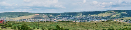 Town Sim and surroundings, Chelyabinsk region, Russia. Located in Southern Urals among mountains. Founded in 1759 on Sim River. Summer landscape. Panoramaの写真素材