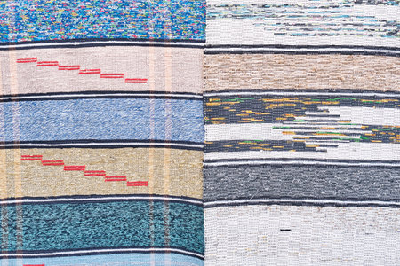 Texture of homespun colorful striped home rugs as textile background. Rustic traditional hand woven...
