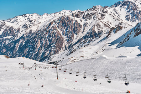 Chairlift, Shymbulak ski resort, the largest ski resort in Central Asia, Almaty, Kazakhstan. Located...