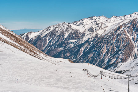 Medeo Valley in Zaili Alatau mountain range, Central Asia, Almaty, Kazakhstan. Talgar peak. Left Talgar gorge. Chairlift in Shymbulak ski resort. winter landscapeの写真素材