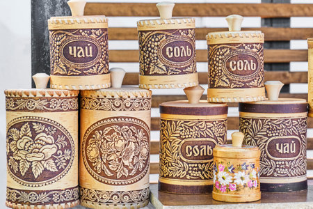 Handmade birch bark tableware with embossing and pattern. Carved and painted tues, boxes, tubes for bulk products, sugar bowls, tea and salt jars. Souvenirs and gifts from Russia.の写真素材