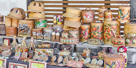 Handcrafted birch bark and wood products with colorful painting and carved patterns. Tues, boxes, tubes, sun visors, eyeglass cases, angels, dolls, mirrors, matryoshka. Souvenirs and gifts from Russia.の写真素材