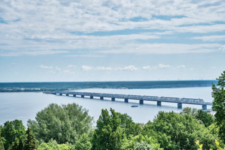 The Imperial Bridge is a combined road and rail bridge across the Volga River, Kuibyshev Reservoir, in the city of Ulyanovsk, Russia, Start of construction 1913. Summer landscape.の写真素材