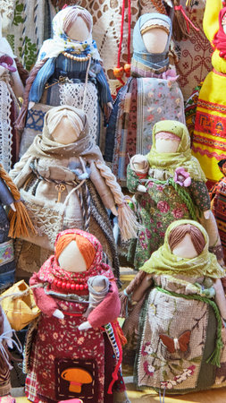 Collection of handmade Slavic textile dolls, crafted with intricate fabrics, lace, and beads....