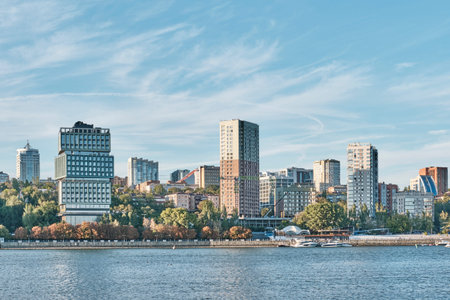 Rostov-on-Don, Russia - October 2, 2025: Scenic view of modern architecture, skyscrapers and waterfront. Beautiful cityscape with blue sky reflected in Don river.のeditorial素材