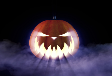 Scary Halloween Pumpkin looking through the smoke.の写真素材