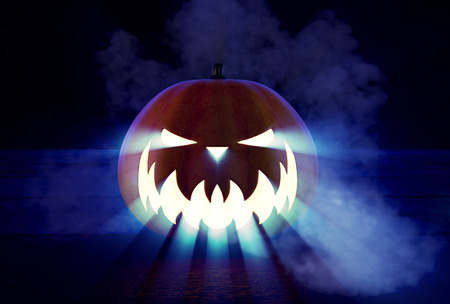 Scary Halloween Pumpkin looking through the smoke.の写真素材