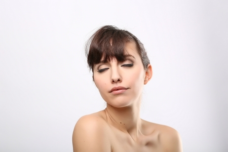 portrait of the woman with beauty face isolated on whiteの写真素材