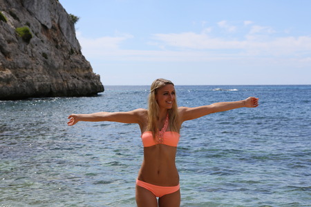 Attractive and sexy girl on the beach in a bikiniの写真素材