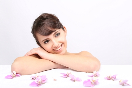 Spa salon. Girl lying on a massage table and relaxの写真素材
