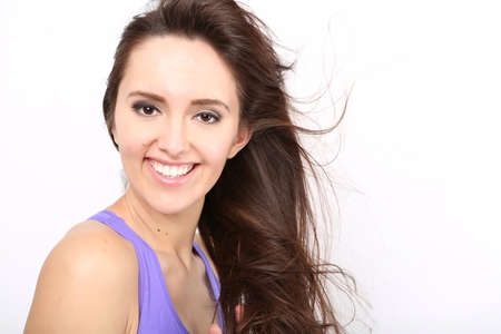 Beauty Girl portrait with long Hair. Beautiful Brunette Woman with Blowing Healthy Hair. Natural Beautyの写真素材
