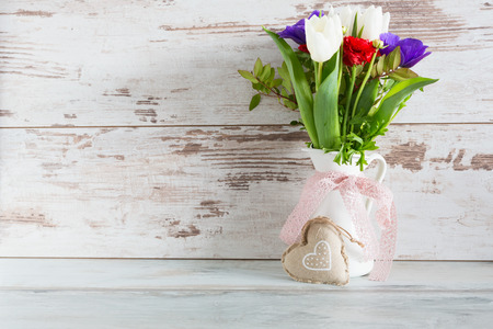 Valentine\'s Day concept. Beautiful tulip bouquet with heart shape boxの写真素材