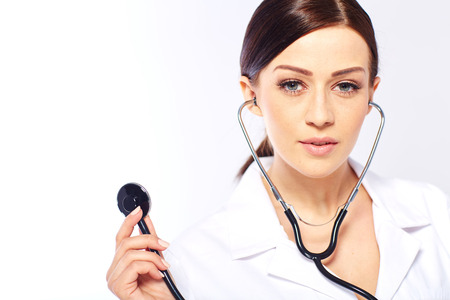 Medical doctor woman in a white studioの写真素材