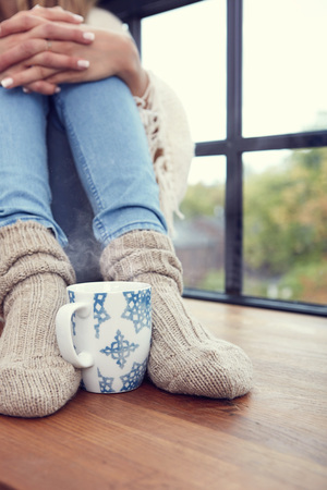 Close up on feet. Winter and Christmas holidays concept.の写真素材