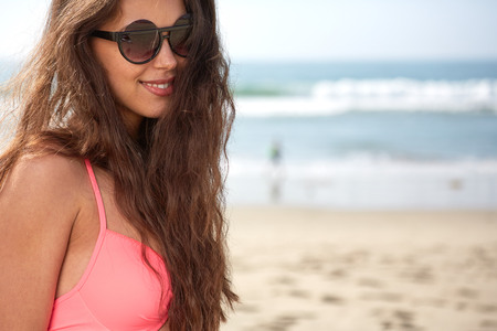 Portrait of a stylish sexy girl in sunglasses and jeans shorts.の写真素材