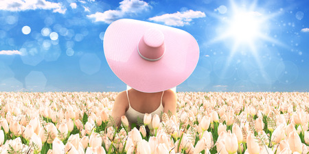 Spring woman with a hat laying in a field of tulips. 3d renderingの写真素材