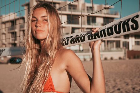 girl standing on the beach. golden hour. california lifestyleの写真素材