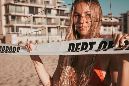 girl standing on the beach. golden hour. california lifestyleの写真素材