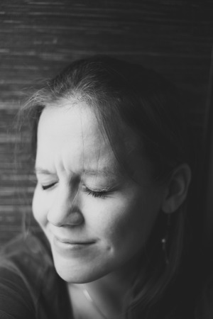 Black and white portrait of the young beautiful girl with closed eyesの写真素材