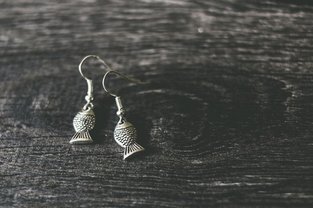 Silver fish earringsの写真素材