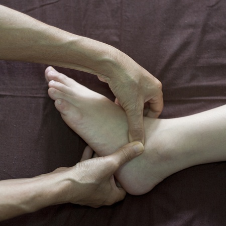 reflexology foot massage, spa foot treatment の写真素材