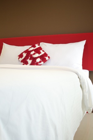 Pillow and Bed in a hotel room at nightの写真素材