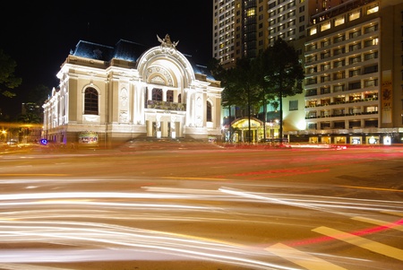 The opera house of Saigon Vietnam with stream of passing traffics