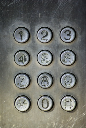 Close up image of a public pay phone keypadの写真素材