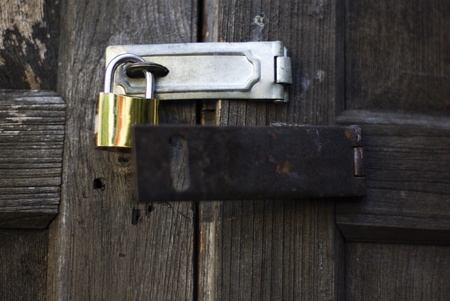 Lock key on vintage wooden doorの写真素材