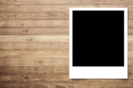 Photo frame on Brown wood plank wall texture background