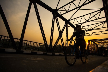 Man ride bicycle silhouette on bridgeのeditorial素材