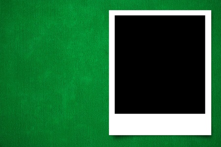 Photo frame on Green carpet background textureの写真素材