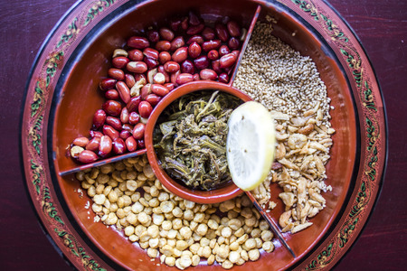 A selection of typical Myanmar snacks: tasty and spicy seeds, nuts and pickled tea leaves.の写真素材