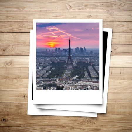 Eiffel Tower memory on photo frame brown wood plank backgroundの写真素材