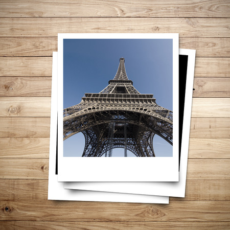 Eiffel Tower memory on photo frame brown wood plank backgroundの写真素材