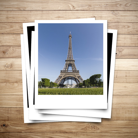 Eiffel Tower memory on photo frame brown wood plank backgroundの写真素材