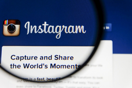THAILAND - SEPTEMBER 2, 2014: Magnifying glass of Instagram landing page website view on web browser.のeditorial素材