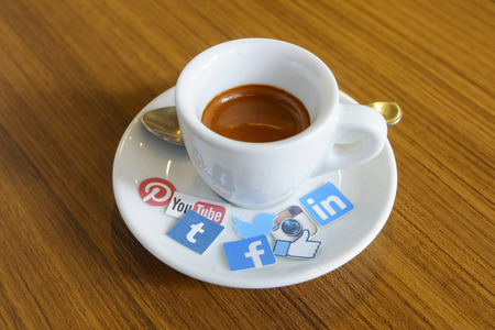 CHIANG MAI, THAILAND - SEPTEMBER 24, 2014: Social media brands printed on sticker and placed on hot coffee cup morning life.のeditorial素材
