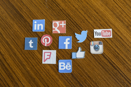 CHIANG MAI, THAILAND - SEPTEMBER 24, 2014: Social media brands printed on sticker and placed on wood table.のeditorial素材
