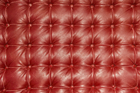Old vintage red leather chair close up detailの写真素材