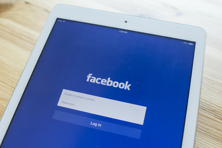 CHIANG MAI, THAILAND - SEPTEMBER 07, 2014: Facebook application sign in page on Apple iPad Air. Facebook is largest and most popular social networking site in the world.のeditorial素材