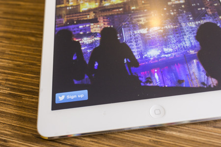 CHIANG MAI, THAILAND - SEPTEMBER 17, 2014: Twitter application sign in page Apple iPad Air. Twitter is largest and most popular social networking site in the world.のeditorial素材