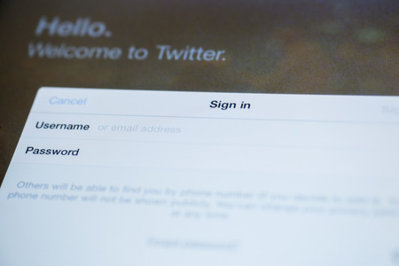 CHIANG MAI, THAILAND - OCTOBER 03, 2014: Twitter application sign in page Apple iPad Air. Twitter is largest and most popular social networking site in the world.のeditorial素材