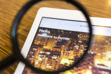 CHIANG MAI, THAILAND - SEPTEMBER 17, 2014: Twitter application sign in page Apple iPad Air. Twitter is largest and most popular social networking site in the world.のeditorial素材