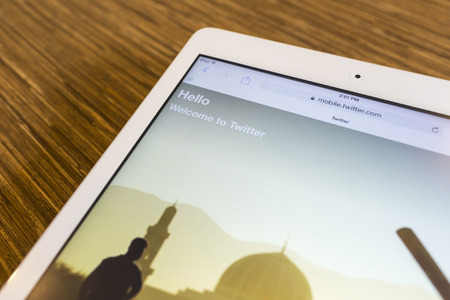 CHIANG MAI, THAILAND - SEPTEMBER 17, 2014: Twitter application sign in page Apple iPad Air. Twitter is largest and most popular social networking site in the world.のeditorial素材