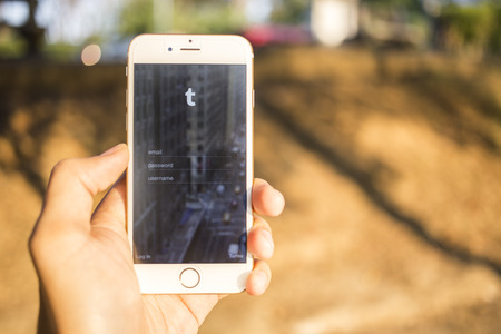 CHIANG MAI, THAILAND - JANUARY 04, 2015: Tumblr micro-blogging service that allows users to post text messages on Apple iphone 6, images, videos, links, quotes and audio to their tumblelog.のeditorial素材